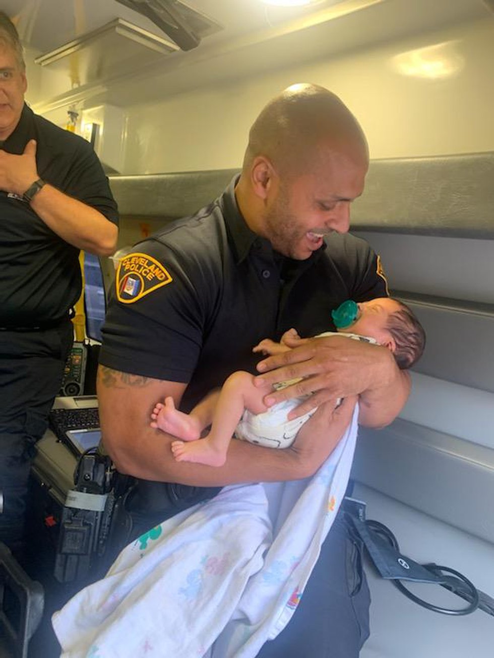 Officer holds baby
