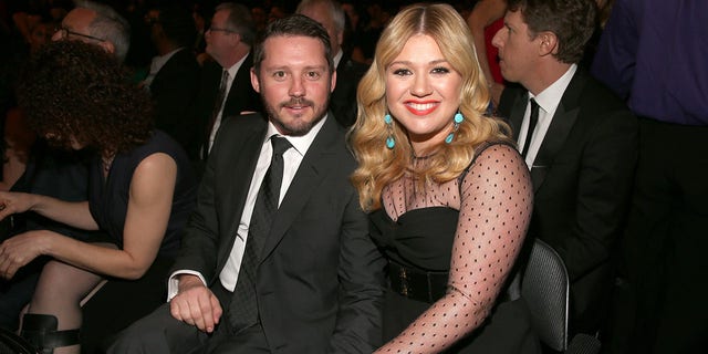 Kelly Clarkson and Brandon Blackstock attend the 55th Annual GRAMMY Awards in February 2013.